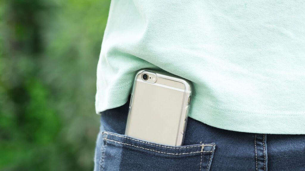 iPhone sticking out of back pocket