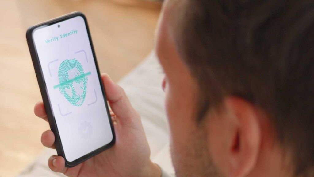 Man confirming his identity with camera phone