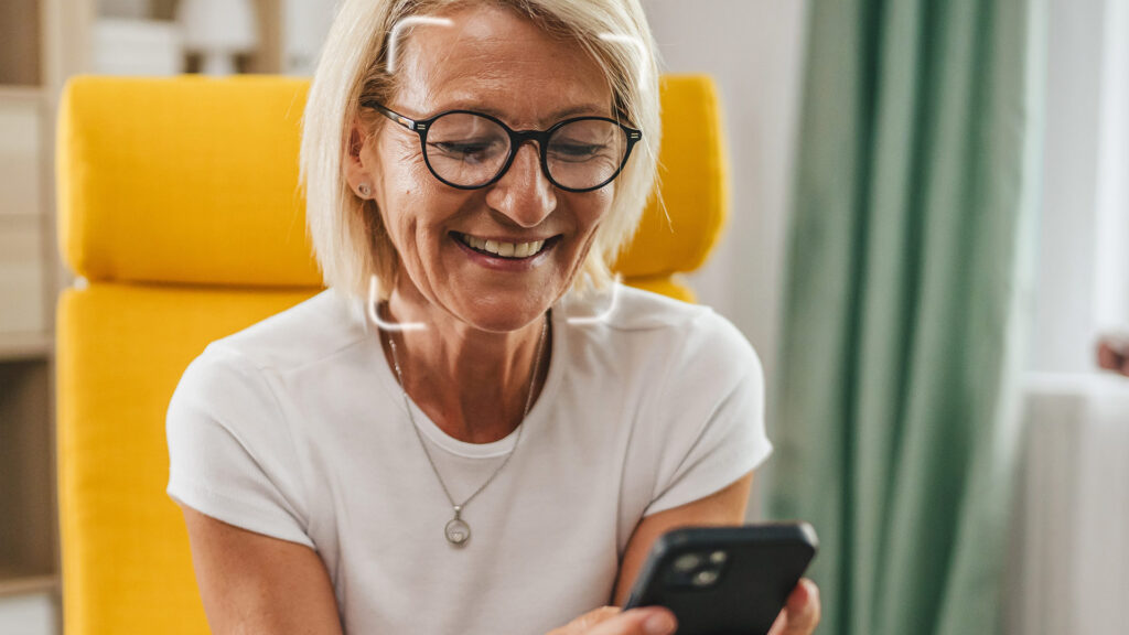 Senior woman looking at her phone