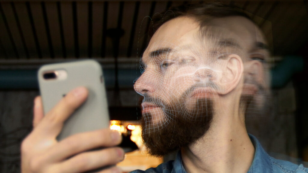 Man moving his face in front of his phone
