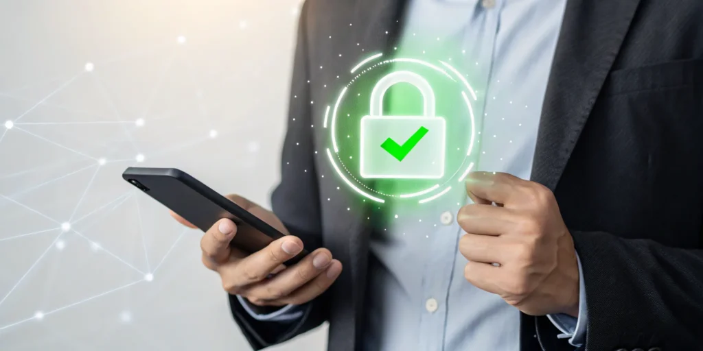 Man using a phone for secure account recovery without a password or SMS, with a padlock and checkmark.