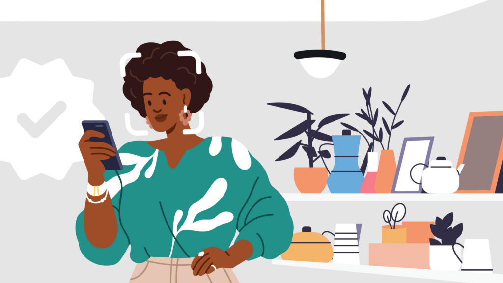 Woman looking at her phone in kitchen